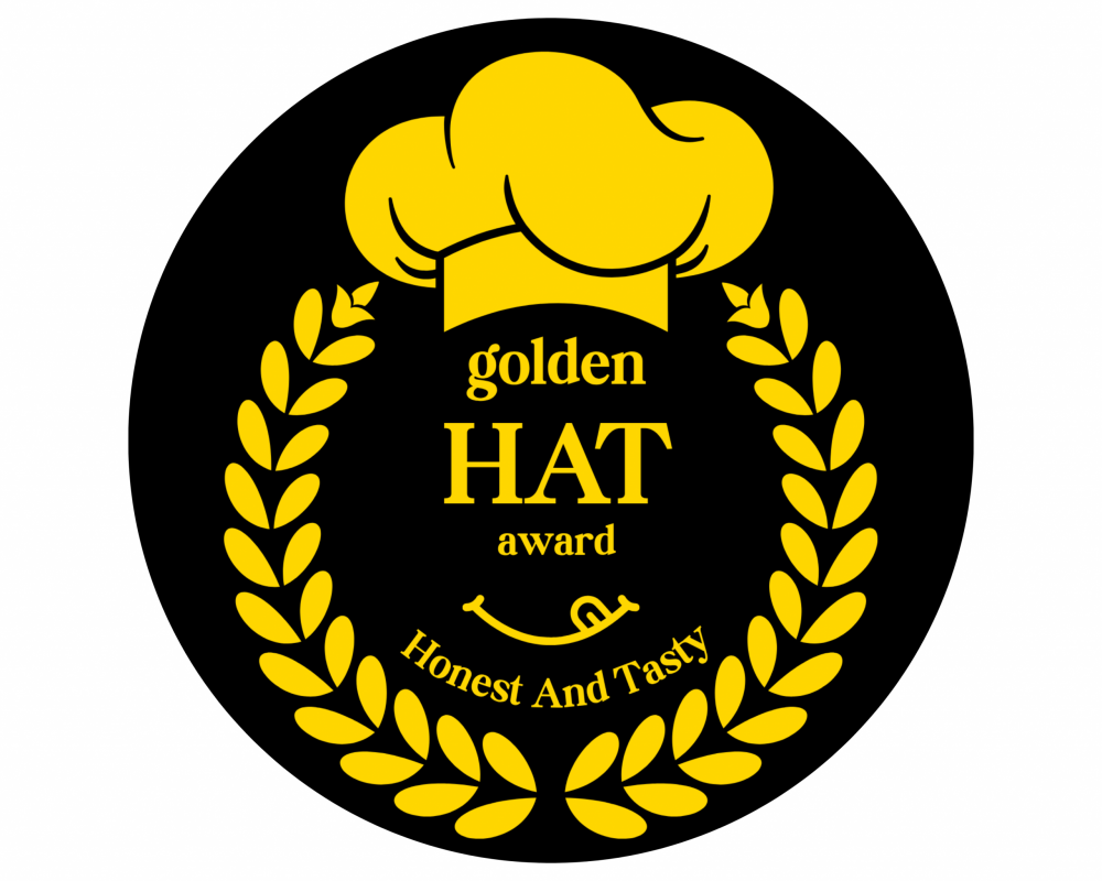 The Golden HAT Award is a prestigious award certification for food and beverage products, designed to recognize brands that deliver both great taste and uncompromised integrity. We celebrate Honest and Tasty products that stand out for their authenticity, quality, and consumer trust. Focused exclusively on vegan food and beverage products in the United Kingdom and European Union, as well as dairy food and beverage products in the United Kingdom and European Union, our certification sets the benchmark for excellence in today’s conscious market. Whether you’re a small artisan producer or an established brand, earning the Golden HAT seal is more than recognition—it’s proof that your products meet the highest standards of honesty and flavour. Often compared to the Great Taste Award, the Golden HAT Award goes a step further by ensuring transparency in labelling alongside exceptional taste. This makes it the ultimate mark of trust for consumers seeking products that are both ethical and delicious.